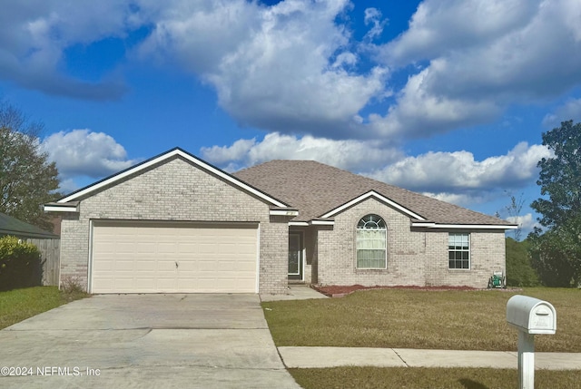 view of front of house with a garage and a front yard