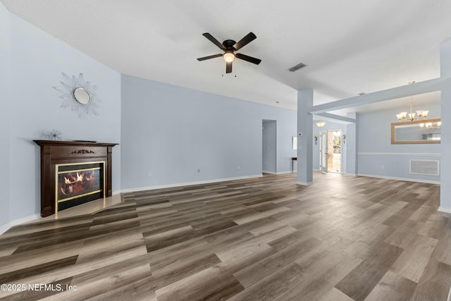 3130 Haverhill Ct, Green Cove Springs, FL 32043 - unfurnished living room featuring visible vents, a fireplace with flush hearth, wood finished floors, and ceiling fan with notable chandelier