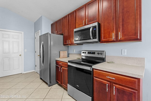 3130 Haverhill Ct, Green Cove Springs, FL 32043 - kitchen featuring light countertops, light tile patterned floors, dark brown cabinets, and stainless steel appliances