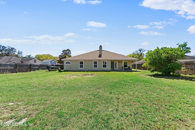 3130 Haverhill Ct, Green Cove Springs, FL 32043 - rear view of property with a fenced backyard and a lawn