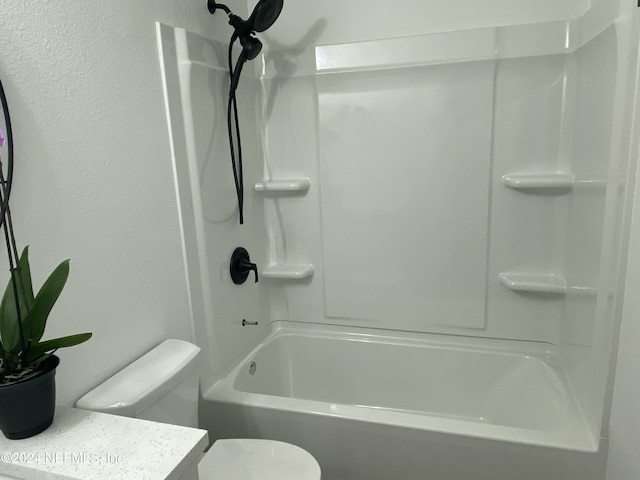 bathroom with shower / bath combination and toilet