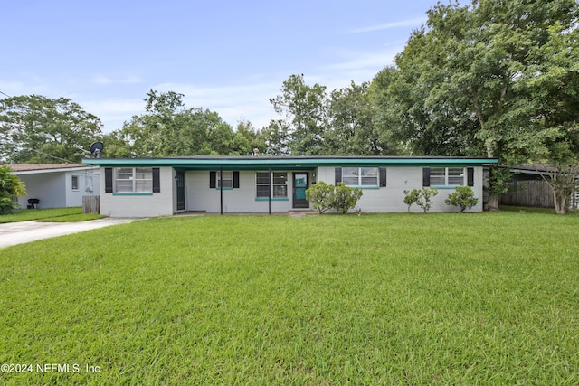 ranch-style house with a front lawn