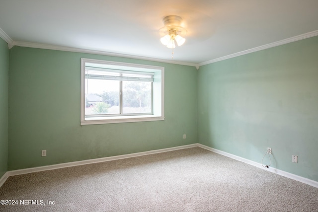 unfurnished room featuring crown molding, carpet floors, and ceiling fan