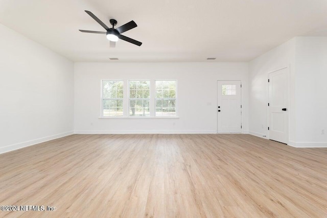 unfurnished living room with ceiling fan and light wood-type flooring