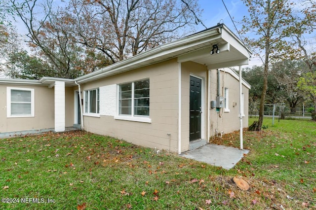 view of home's exterior featuring a yard