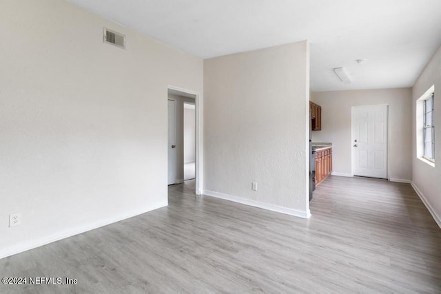 unfurnished living room with light wood-type flooring