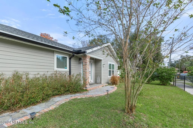 exterior space featuring a front lawn