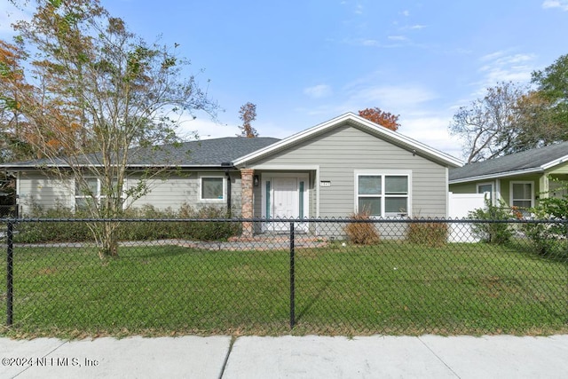 ranch-style home with a front lawn