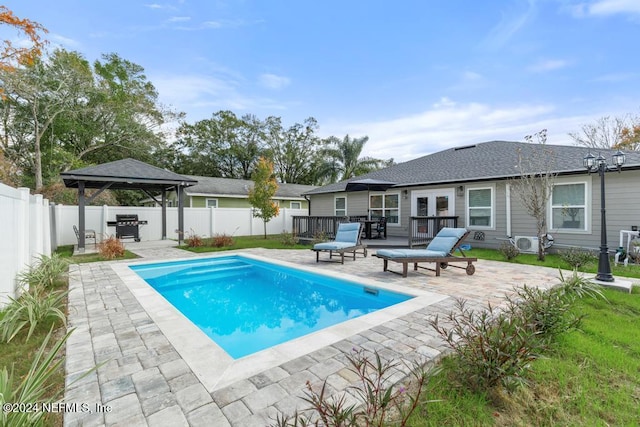 view of swimming pool with a gazebo, a patio area, and grilling area