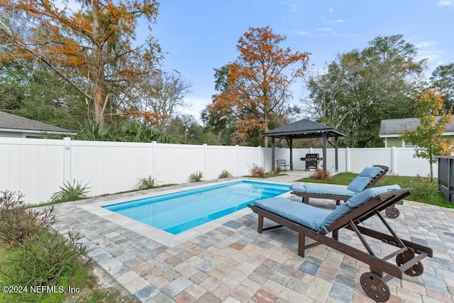 view of swimming pool featuring a gazebo and a patio area