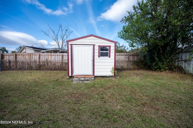 view of outbuilding with a lawn