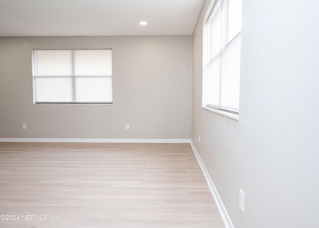 unfurnished room featuring light wood-type flooring