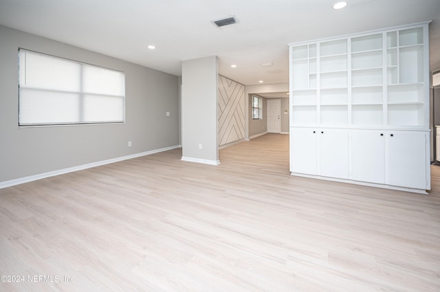 unfurnished living room featuring light wood-type flooring