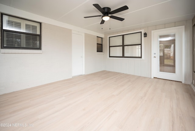 empty room featuring ceiling fan and light hardwood / wood-style floors