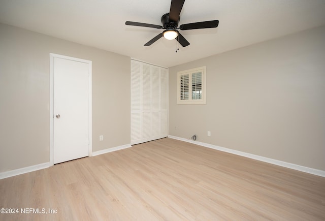 unfurnished room featuring ceiling fan and light wood-type flooring