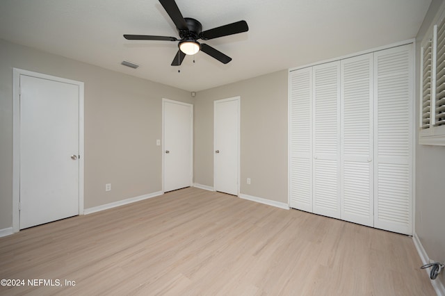 unfurnished bedroom featuring light hardwood / wood-style floors and ceiling fan