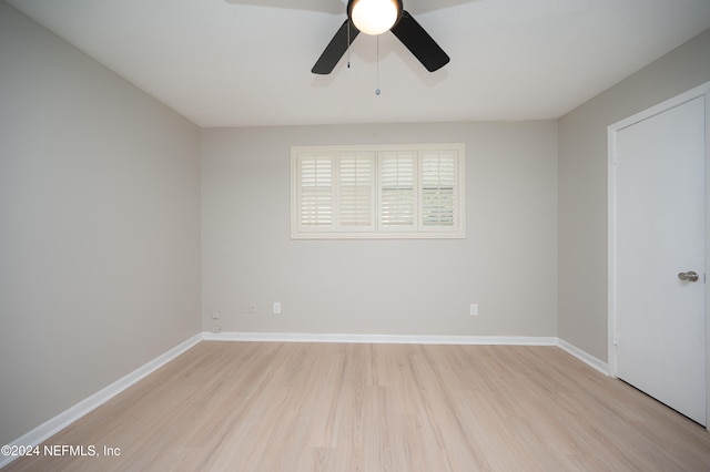 spare room featuring ceiling fan and light wood-type flooring