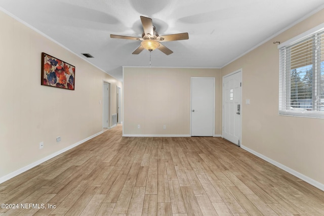 unfurnished room featuring ceiling fan, light hardwood / wood-style floors, and ornamental molding