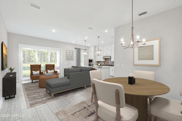 dining area with a notable chandelier