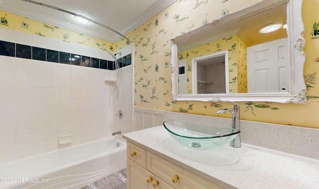 bathroom with vanity, washtub / shower combination, and crown molding