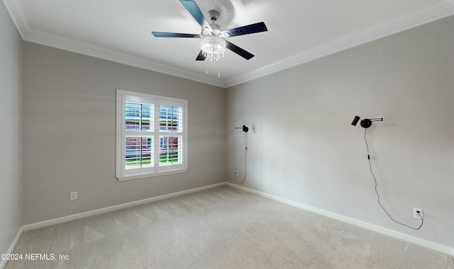 unfurnished room featuring light carpet, ceiling fan, and ornamental molding