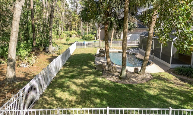 view of yard with a fenced in pool