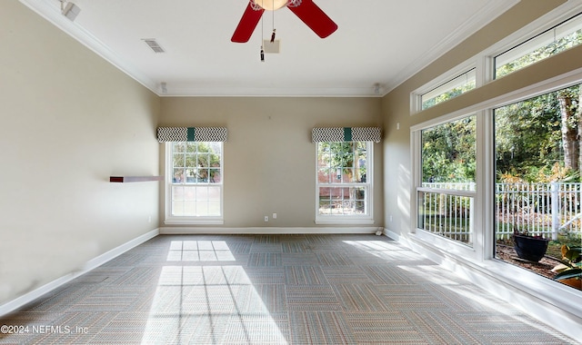 unfurnished sunroom with ceiling fan