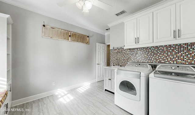 laundry area featuring washer and clothes dryer, ceiling fan, cabinets, and ornamental molding