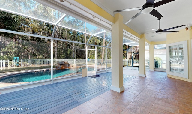 view of pool with a patio area, ceiling fan, and a lanai