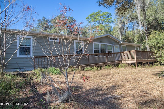 rear view of property with a deck