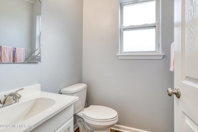 bathroom with vanity and toilet