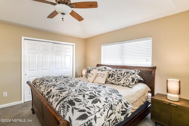 carpeted bedroom featuring ceiling fan and a closet