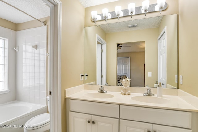 full bathroom with vanity, toilet, shower / bathtub combination, and a healthy amount of sunlight