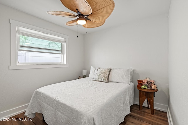 bedroom featuring dark hardwood / wood-style flooring and ceiling fan