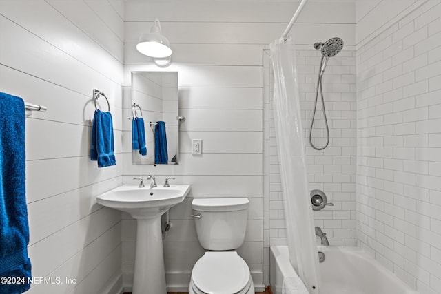 bathroom with shower / bath combo with shower curtain and toilet