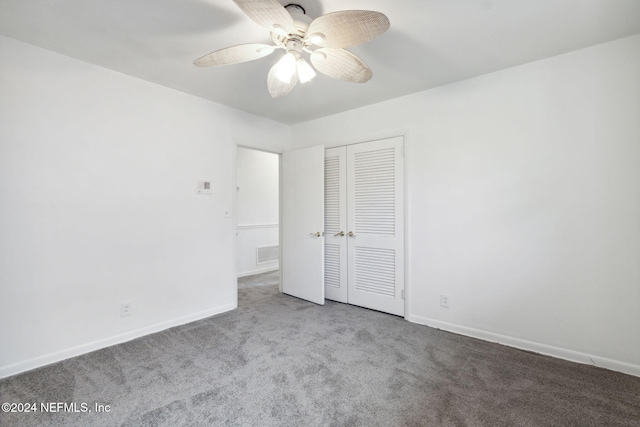 unfurnished bedroom with ceiling fan, a closet, and carpet