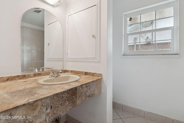 bathroom featuring tile patterned flooring and sink