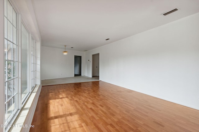 spare room with light hardwood / wood-style floors