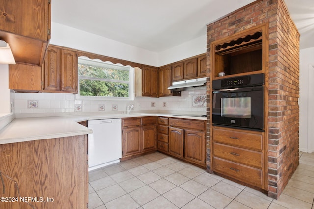 kitchen with light tile patterned flooring, backsplash, and black appliances