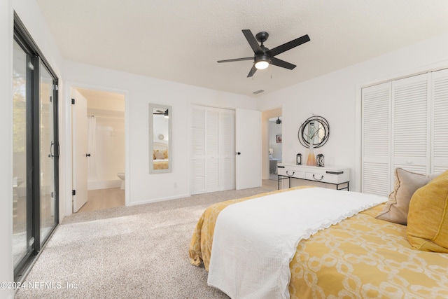 carpeted bedroom featuring access to exterior, ensuite bathroom, a textured ceiling, ceiling fan, and multiple closets