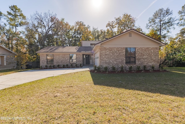 ranch-style home with a front yard