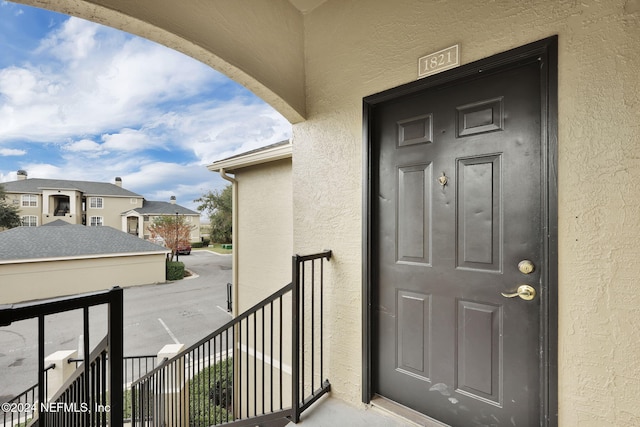 entrance to property with a balcony