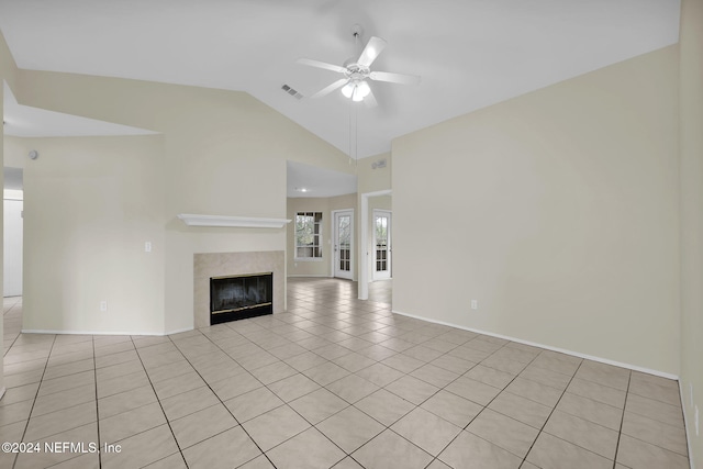 unfurnished living room featuring ceiling fan, light tile patterned floors, and lofted ceiling