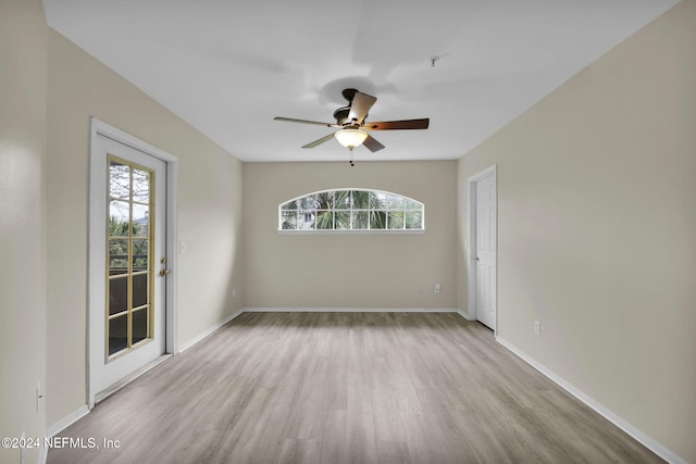 spare room with ceiling fan and light hardwood / wood-style floors