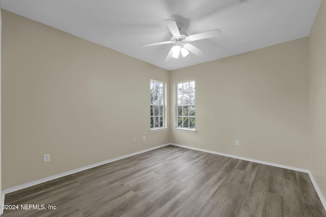 empty room featuring ceiling fan and wood-type flooring