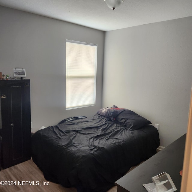 bedroom featuring hardwood / wood-style floors