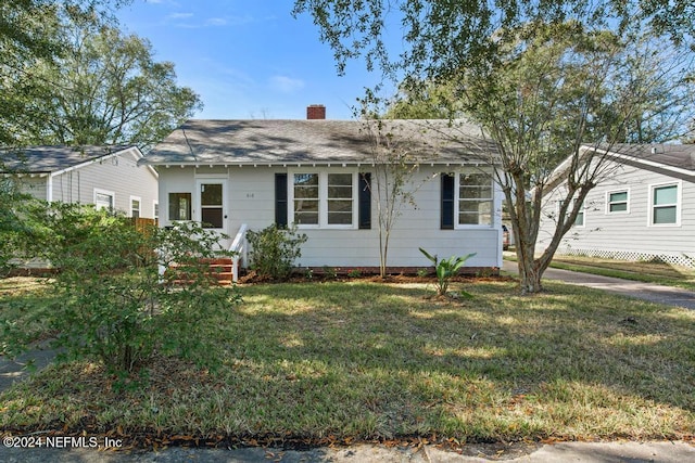 ranch-style house with a front yard