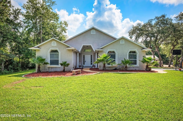 single story home featuring a front yard