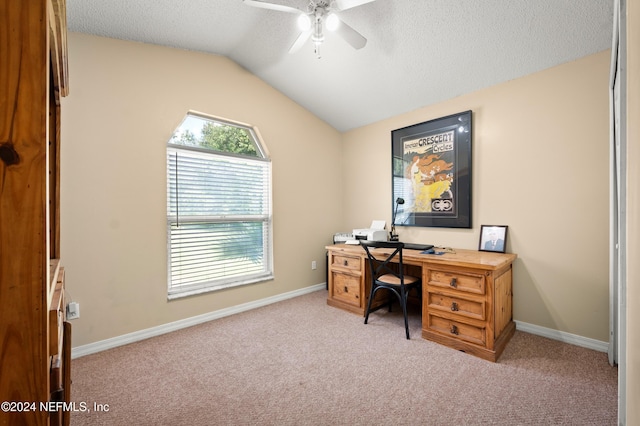 office featuring a textured ceiling, ceiling fan, light colored carpet, and lofted ceiling