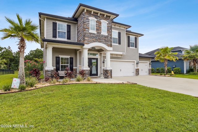 view of front of house with a front lawn and a garage